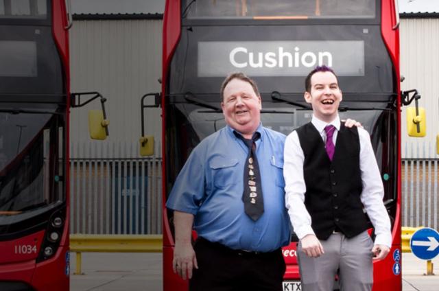 Sean and his dad next to some double decker buses for our Calm, Cushion, Call campaign